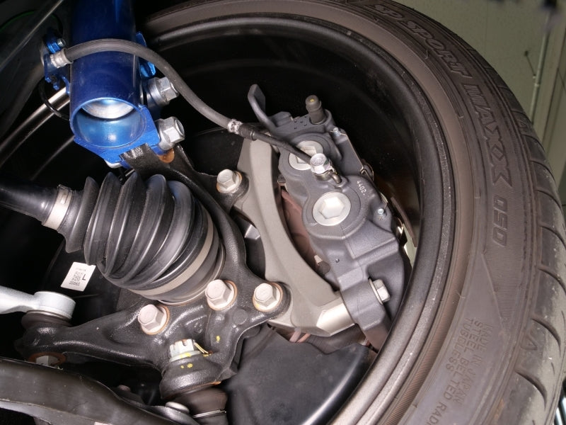 Cusco 23-25 Toyota GR Corolla Light Weight Front Brake Caliper Bracket - Billet Aluminum